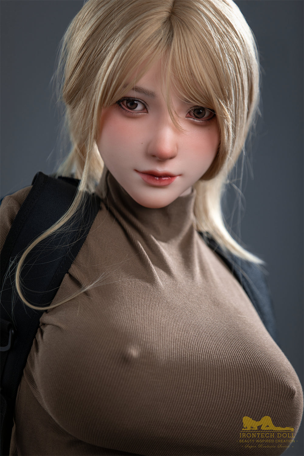Close-up of Kitty E.'s silicone face and breasts showing fine detail