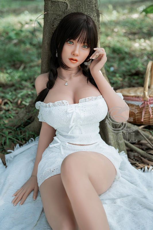 Realistic silicone-like sex doll with natural body curves and large breasts.