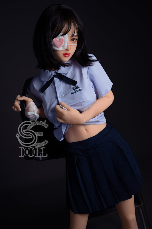 Ariel 153cm F Cup TPE sex doll by SEDOLL posing in schoolgirl outfit.