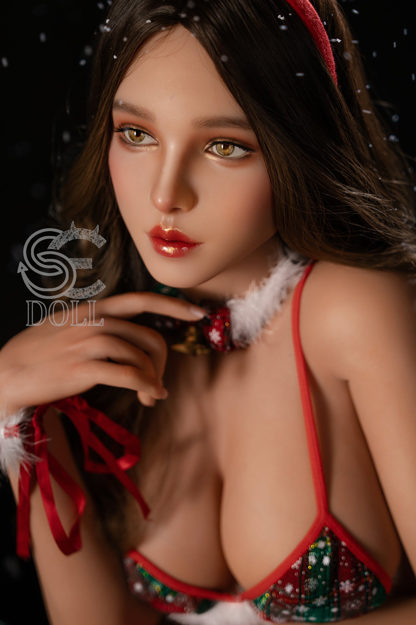 Sexy love doll with brunette hair and C-cup breasts posing under Christmas decorations.