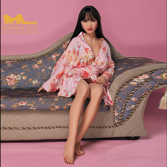 Yumiko 154cm F Cup TPE Sex Doll by Irontech seated on sofa – lifelike Asian sex doll