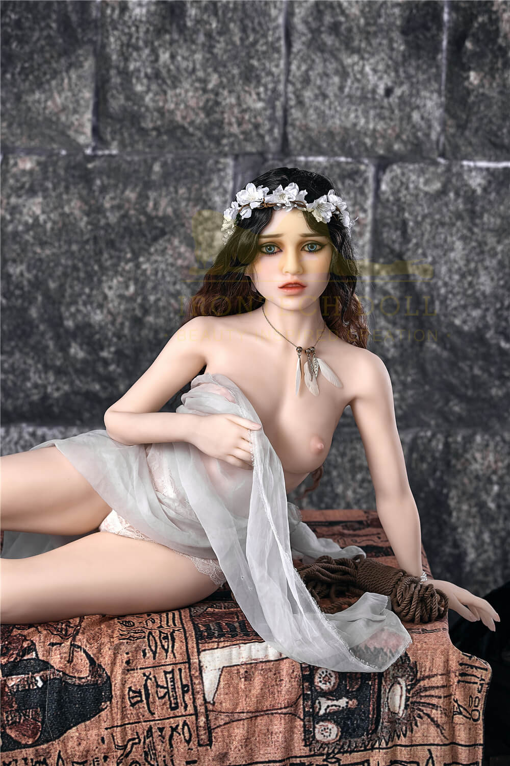 Irontech adult sex doll sitting naked in a sexy pose.