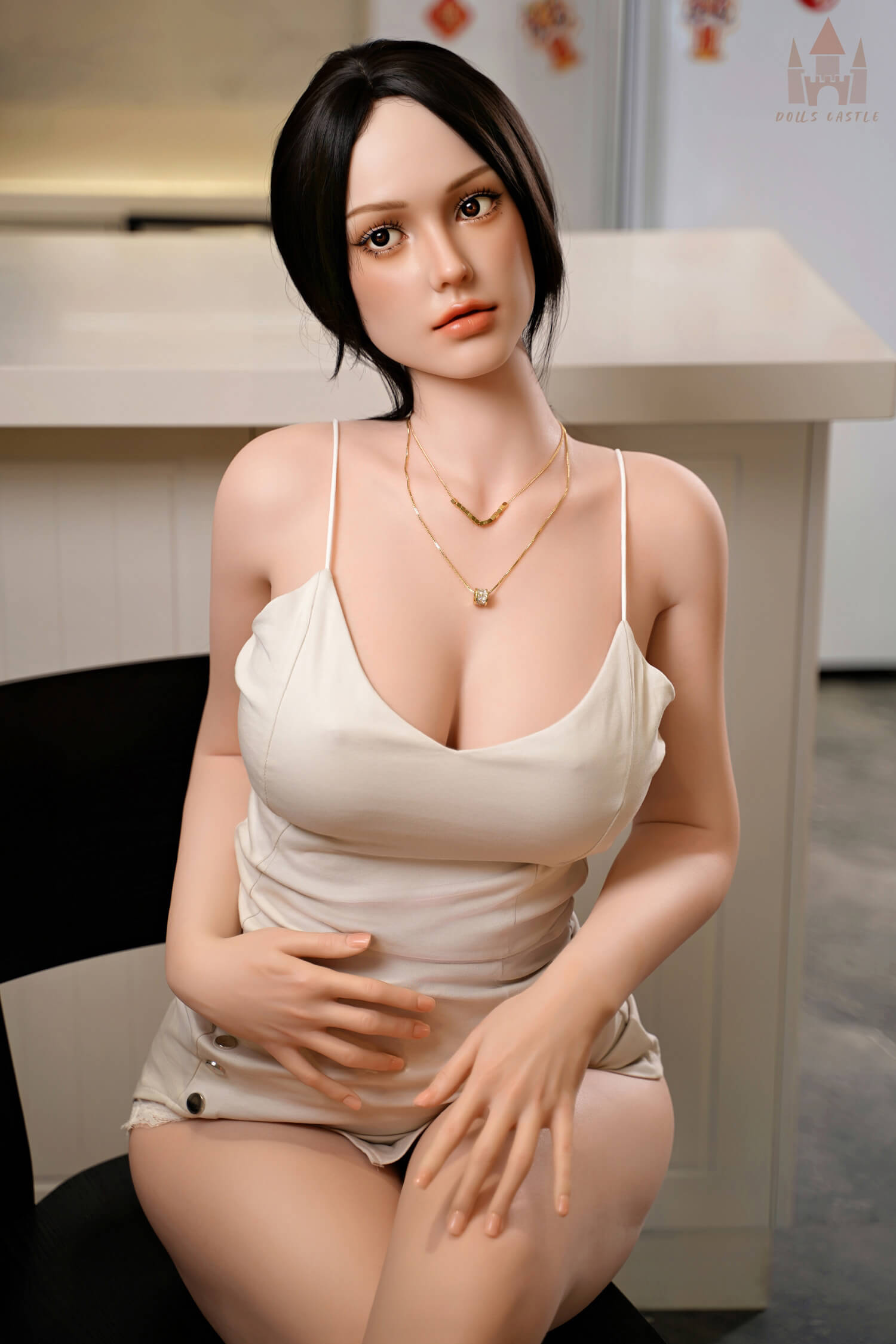 Kimora 163cm realistic sex doll sitting pose with detailed silicone skin.