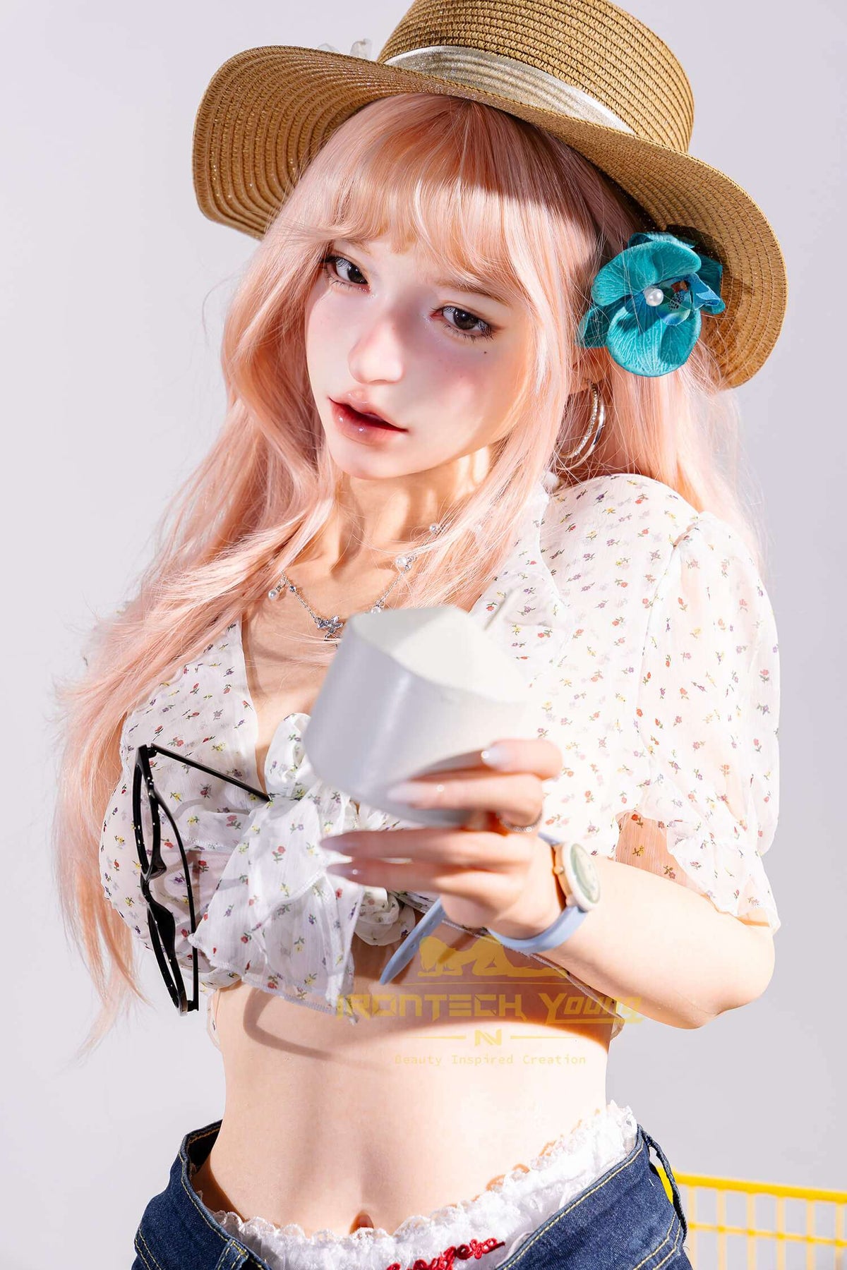 Mio D Cup Silicone Sex Doll wearing a floral top and sun hat